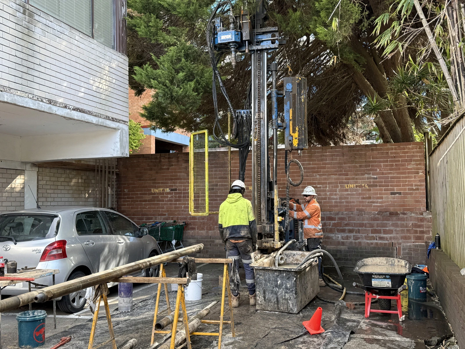 Geotrace field crew operating a drilling rig on site